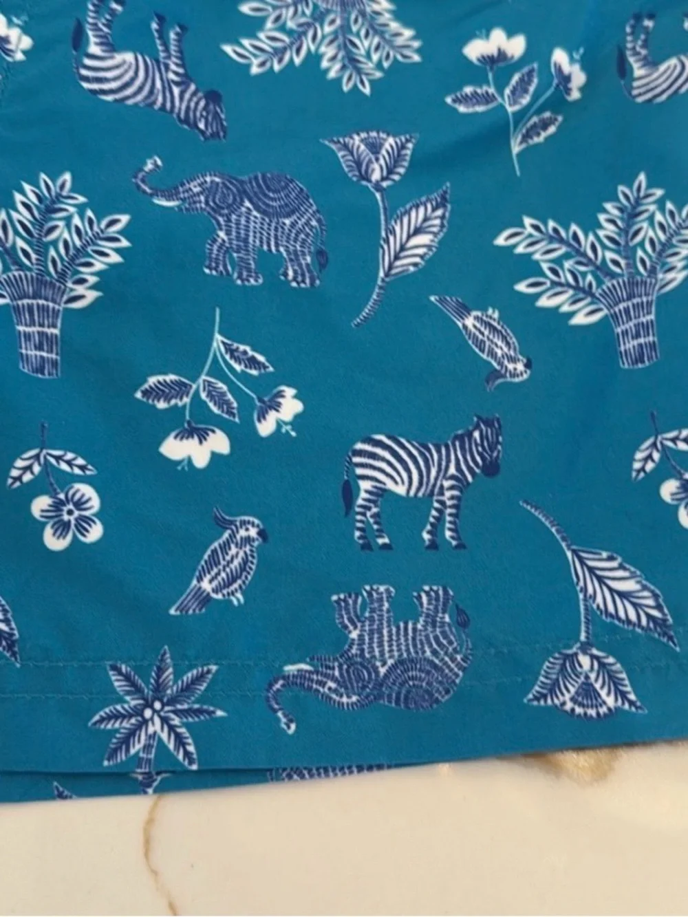 Janie and Jack Teal World Love Swim Trunks with Animal Print